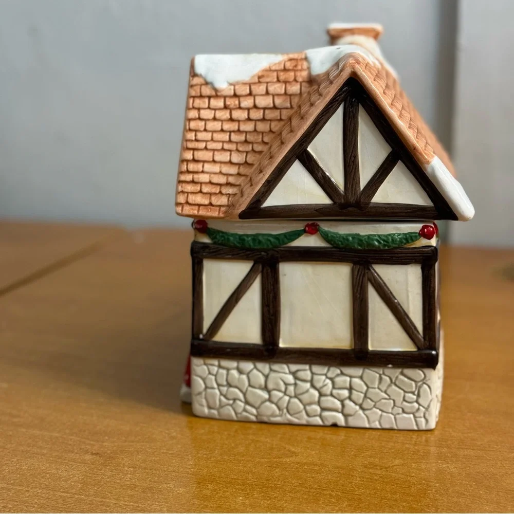 Vintage Christmas cottage cookie jar with people in‎ door